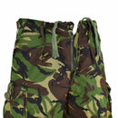 Genuine British Army DPM combat trousers in woodland pattern with cargo pockets and adjustable waist tabs.