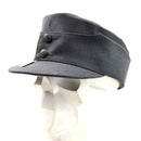 military cap with visor and neckflap in gray color