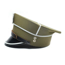 Vintage Polish army officer peaked cap in olive wool with black visor and eagle cockade insignia detail