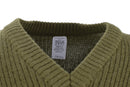 Close-up of olive green wool V-neck sweater with ribbed knit pattern and visible size label inside collar.