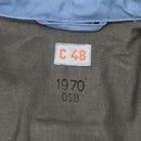 Close-up of 1970 vintage Swedish Civil Defense jacket label with size C48 and blue denim lining visible.