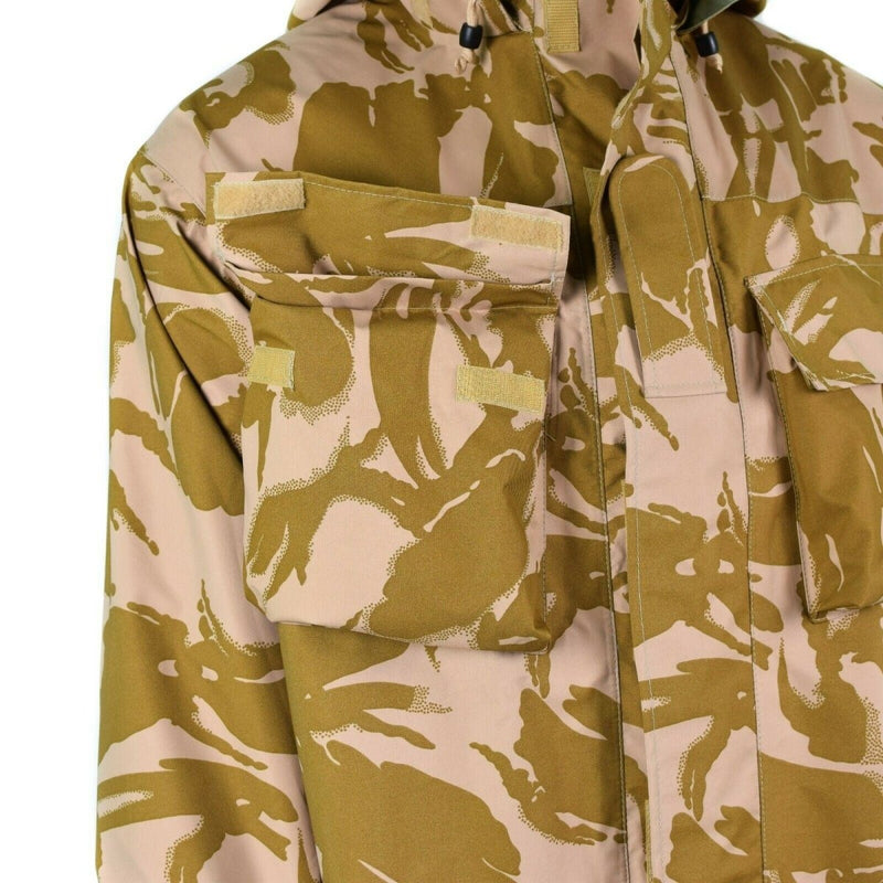 Close-up of British Army desert camo combat jacket showing chest pockets, Velcro closures, and waterproof Gore-Tex fabric.