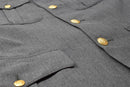 Close-up of Danish Civil Defence Forces gray military uniform jacket with gold buttons and pocket details