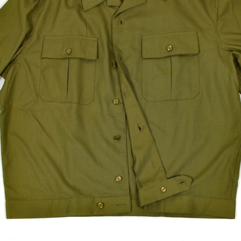 Close-up of a genuine Hungarian army shirt in olive khaki with buttoned chest pockets and durable fabric.