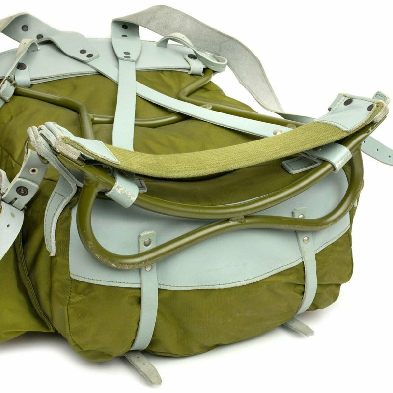 Vintage Norwegian military backpack with metal frame and leather straps in olive green canvas for rugged outdoor use