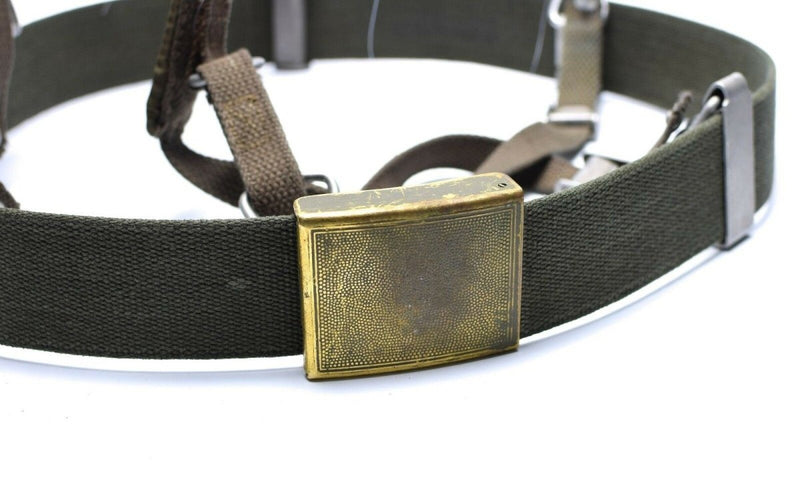 Close-up of German army Y-strap suspenders belt with brass buckle and olive green tactical webbing belt.
