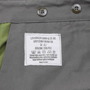 Close-up of Leo Köhler knee-length shorts label showing size, fabric composition, washing instructions, and origin.