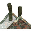 Close-up of MFH Flecktarn camouflage waterproof tarpaulin corners with reinforced fixed loops for securing shelter or ground cover