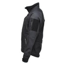 Black MIL-TEC softshell jacket with zippered pockets, vented armpits, and water-resistant fabric for tactical and outdoor use.