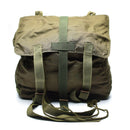 Original Austrian Army olive green vintage combat day pack with buckle closure and adjustable carrying strap.