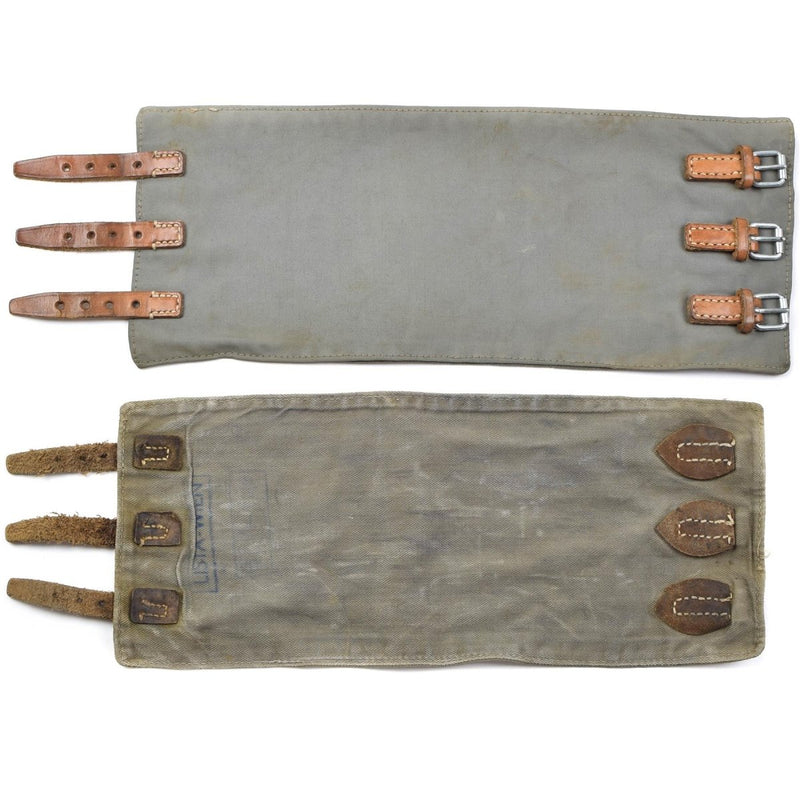 Pair of vintage Austrian Army M58 leg gaiters with leather straps for outdoor and military use