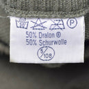 Fabric label with text and symbols on a textured background