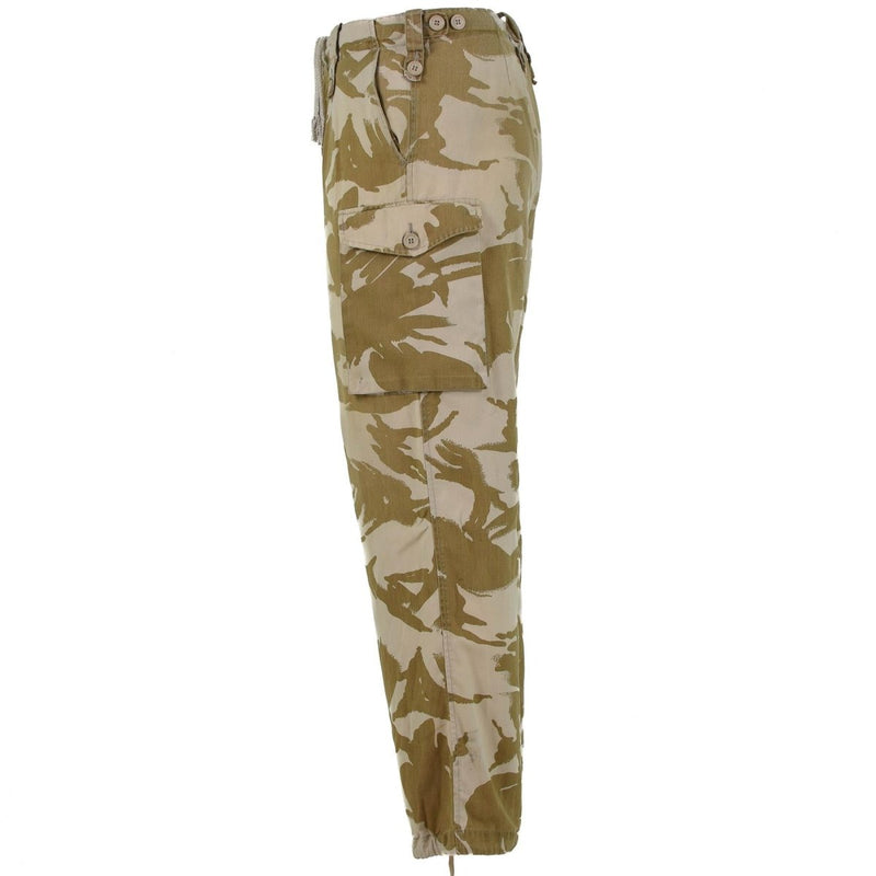 Side view of lightweight British army desert combat trousers with desert camouflage and multiple pockets