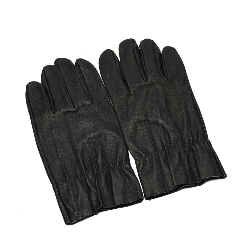 Pair of original Czech army combat gloves made of genuine black leather with elasticated cuffs.