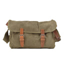 Vintage Czech military canvas shoulder bag with leather straps and sturdy buckle closures on white background