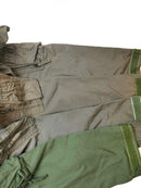 Close-up of durable green and gray aramid carbon fiber flight suit coveralls with zipper and Velcro cuffs.