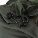 Close-up of olive green ripstop fabric with metal hardware on the original Dutch military duffel bag.