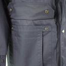 Close-up of dark blue Dutch police issue parka pocket with snap buttons on durable military surplus jacket liner