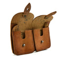 Vintage French army double magazine pouch made of brown leather with flap closures and metal buttons.
