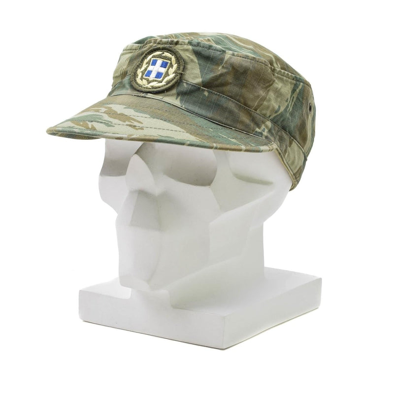 Greek army lizard camo lightweight summer field cap with military insignia on white mannequin head.