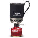 Compact Primus Lite backpacking stove system with insulated pot and red fuel canister for efficient outdoor cooking.